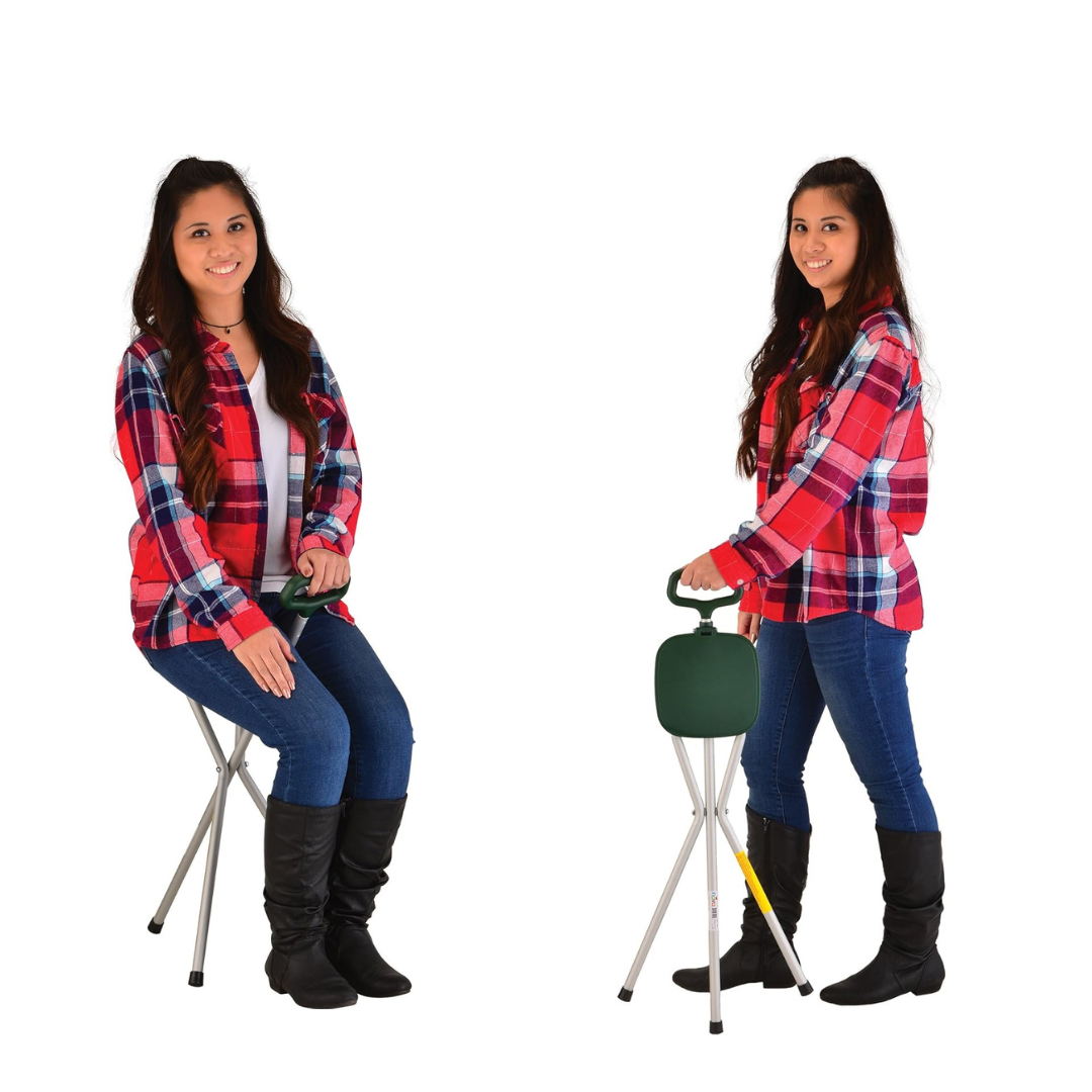 Two women in red plaid shirts, jeans, and black boots show the Nova Folding Seat Cane—Portable Lightweight Seat; one sits on its built-in seat while the other uses it for support against a plain white background showcasing its versatility.