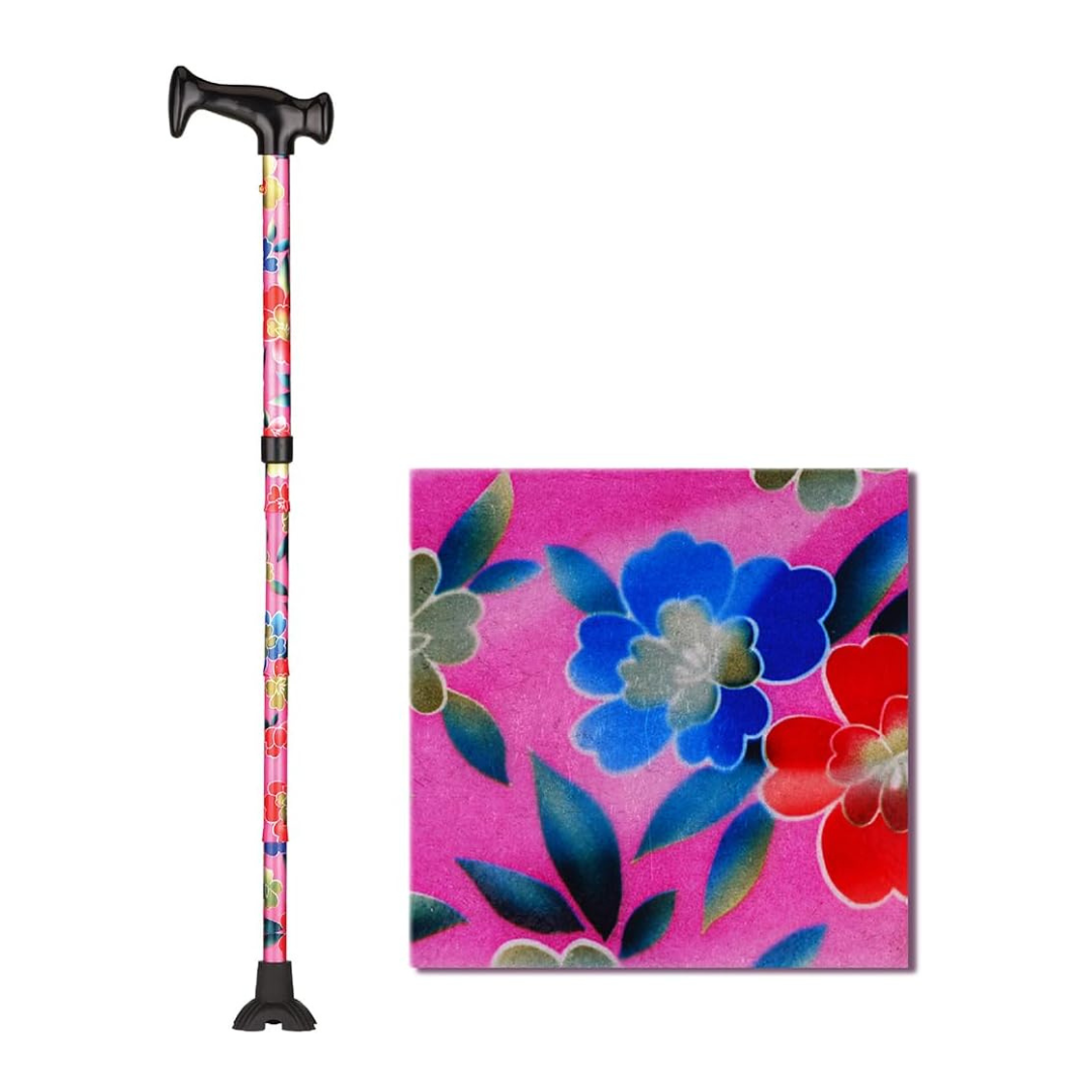 The Nova Folding Walking Cane with Wood Grip Handle & Quad Tip features a pink floral pattern with red, blue, and white flowers accented by green leaves. A close-up inset displays the vibrant design on the cane’s shaft.