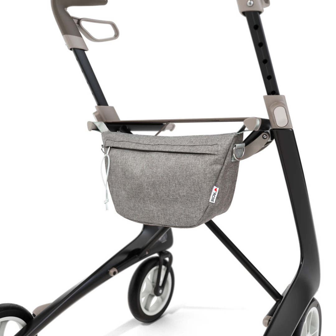 Enhance your ByAcre Carbon Fiber Rollator with this modern black and gray Organizer Bag, featuring a zippered pouch for convenient storage and improved mobility—ideal for those seeking functional rollator accessories.