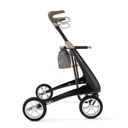 A stylish Organizer Bag for ByAcre Carbon Fiber Rollators, shown in side profile on a modern black and silver walker—features sleek storage for essential mobility accessories with minimalist design.