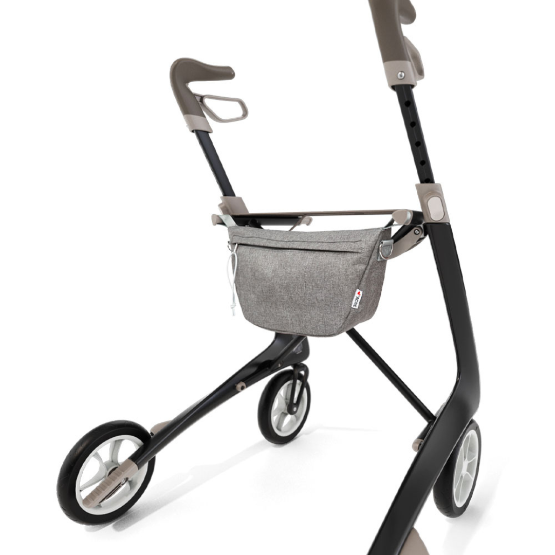 The Organizer Bag for ByAcre Carbon Fiber Rollators is a stylish gray bag attached to the rollator frame, shown on a plain white background—ideal for carrying essentials and upgrading your mobility accessories.