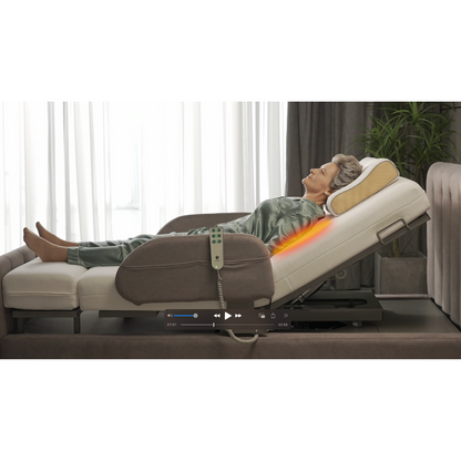 An elderly person is relaxing on the Starsleep Orin Rotating Full Electric Lift Assist Bed with their head elevated, wearing a green satin outfit. The attached remote indicates heat therapy and air chamber massage, highlighted by an orange glow near the lower back.