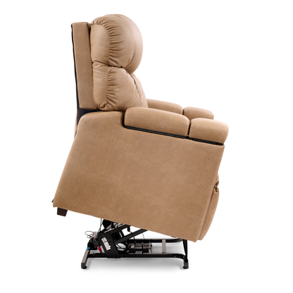 The Golden Cloud+ PR511 Recliner with Lift Assist, Heatwave & Nirvana Massage is shown in tan upholstery from the side, partially elevated by its metal lift mechanism, revealing its mechanical components underneath.