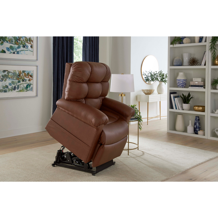 A Golden Tech PR515 Leather Cloud Recliner with Lift Assist is partially raised in a modern living room, featuring light-colored walls, botanical art, a white bookshelf with decor, a round mirror above a console table, and dark curtains enhancing the space.