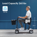 A man in a white shirt and gray pants sits on a Paiseec D3 Lightweight Portable Mobility Scooter with a front basket, airline-approved; it has a load capacity of 265 lbs and measures 35.0 inches in height by 38.8 inches in length, against a blue wall.