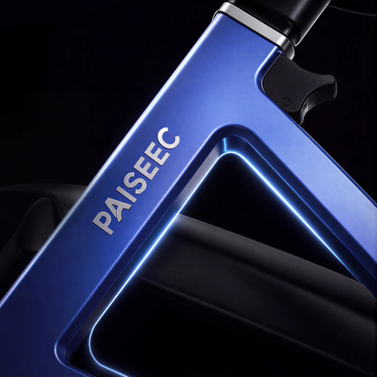 Close-up of the modern blue frame of the Paiseec FLEX 3-in-1 Lightweight Folding Mobility Device, with the brand name PAISEEC embossed on it. The lightweight frame features sleek, angular lines and is illuminated by soft lighting against a dark background.
