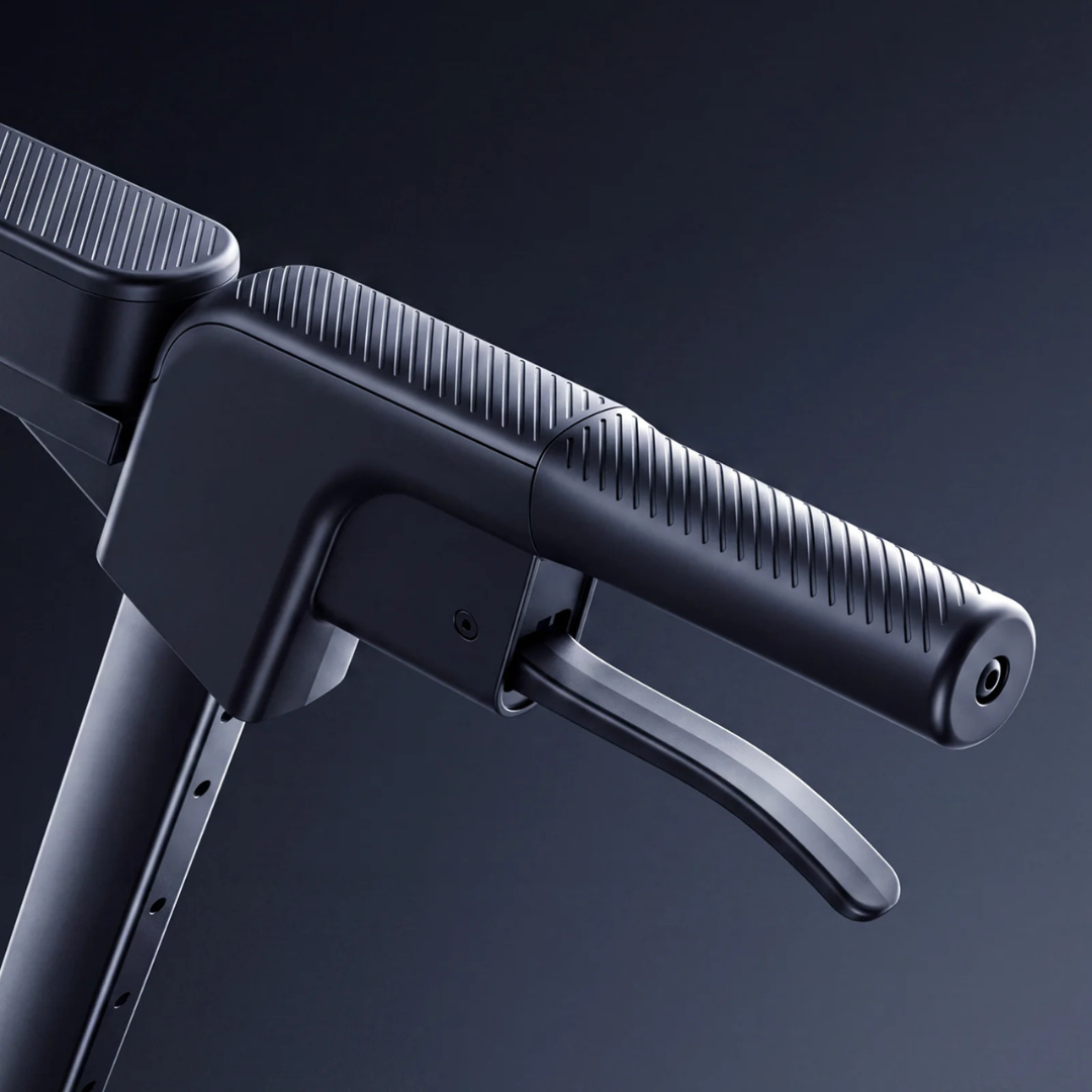 Close-up view of a black, modern handlebar and brake lever on the Paiseec FLEX 3-in-1 Lightweight Folding Mobility Device against a dark background. The handlebar features a textured grip and sleek, minimalist design, showcasing this innovative mobility device’s cutting-edge style.