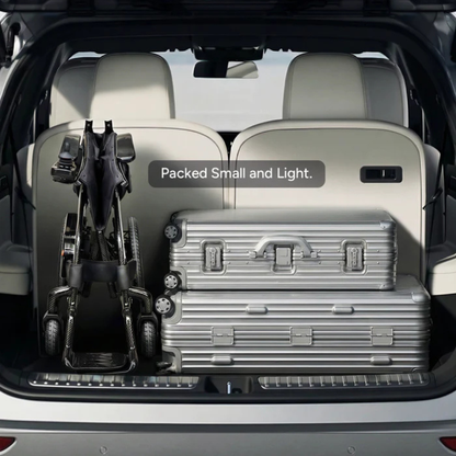 A folded Paiseec Q5 Carbon Fiber Electric Wheelchair and two silver suitcases fit neatly in a car trunk. The text overlay reads “Packed Small and Light,” highlighting the wheelchair’s compact, lightweight design for travel.