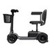 The Paiseec S1 Portable Electric Mobility Scooter, black and compact with a front basket, offers up to 25-mile range and all-terrain capability. It features a padded seat, armrests, four wheels for durability, and an elevated seat on a vertical support post.