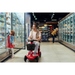 A man on a Paiseec S3 Portable Mobility Scooter, recognized for its long battery life, navigates a grocery store aisle while a young girl reaches into a freezer. Another shopper is visible as bright lights illuminate shelves stocked with products.