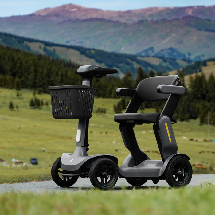 A Paiseec S3 Portable Mobility Scooter, featuring a futuristic black design, powerful performance, effortless folding, and a small front basket, is parked on the road. Lush green hills and scattered trees decorate the landscape under a clear sky.