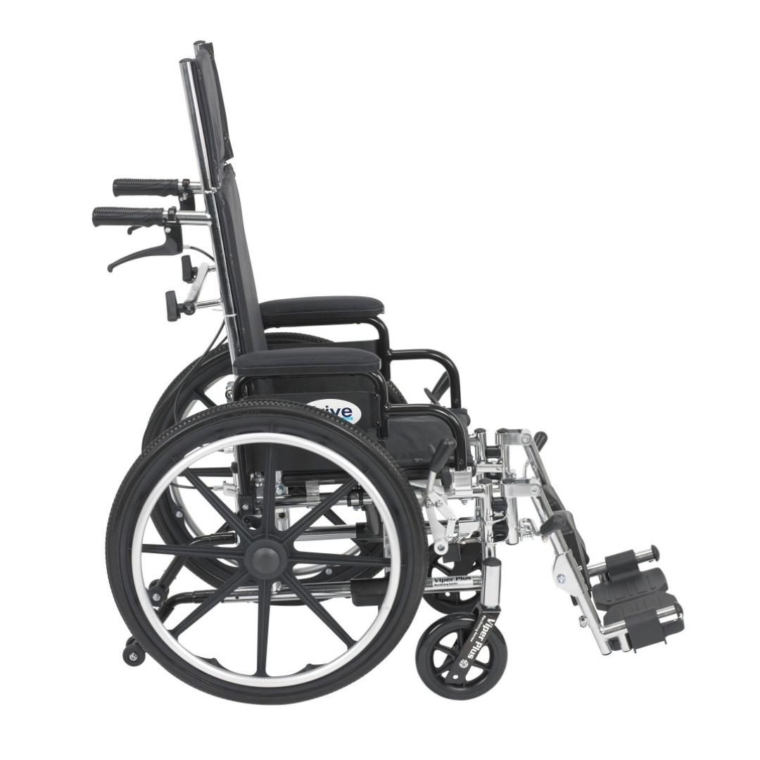The Drive Pediatric Viper Plus Hydraulic Reclining Wheelchair, shown from the side in black and silver, features a heavy-duty chrome steel frame, large rear wheels, small front casters, footrests, armrests, and rear hand grips.
