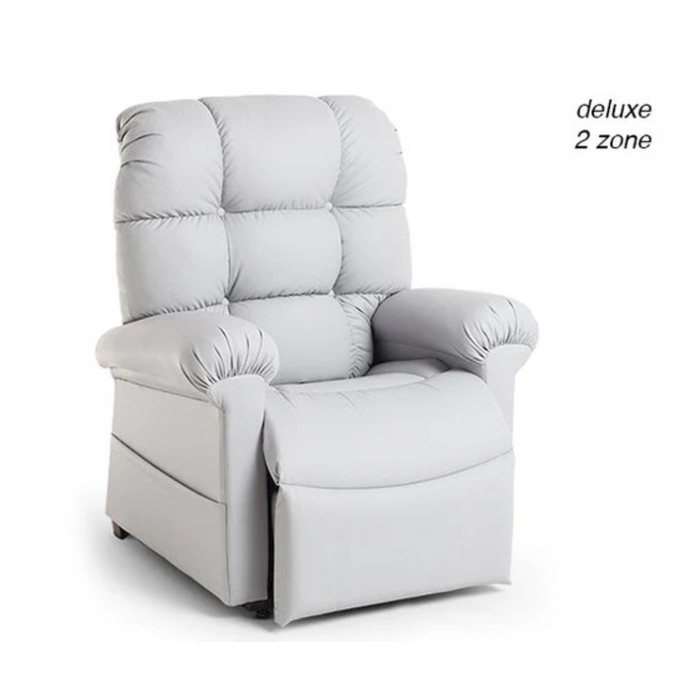 A plush, light grey armchair with a high back, tufted cushions, and padded armrests features an extended footrest for reclining. The Deluxe 2 zone mark appears on the Journey Perfect Sleep Recliner & Lift Chair with Heat, designed for therapeutic relaxation.