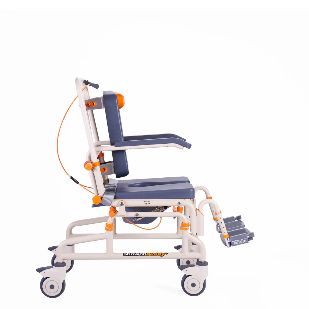 A side view of the ShowerBuddy Petite Buddy P1 Child & Small User Kit, a blue and white medical transport chair with armrests, footrests, safety belts, wheels, orange adjustment knobs, and handles for enhanced patient mobility and support.