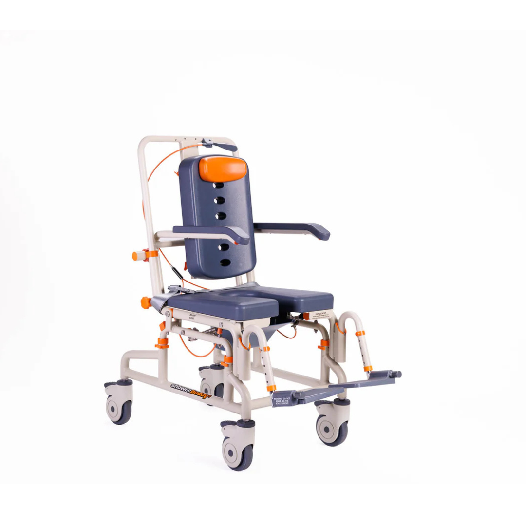 The ShowerBuddy Petite Buddy P1 Child & Small User Kit is a medical shower and commode chair for children and small users, featuring a blue cushioned seat and backrest, armrests, adjustable footrest, and four wheels for mobility and hygiene support.