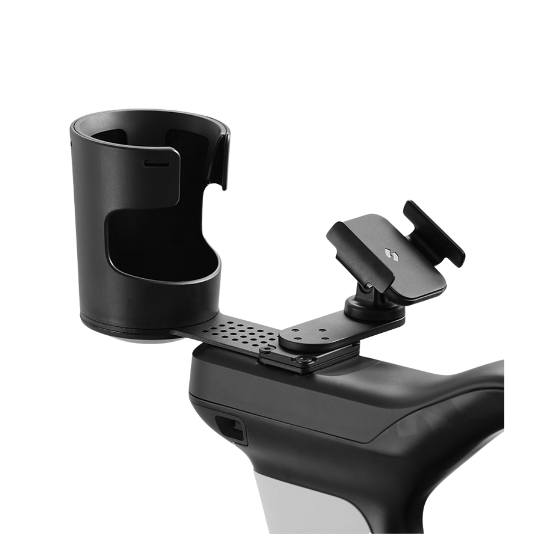 Phone & Cup Holder | Strutt ev1 Compatible, featuring a black cup holder and adjustable phone mount attached to the handlebar of a stationary exercise bike, designed with the modern, minimalistic style of the STRUTT ev¹.