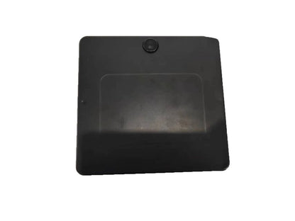 The ComfyGo Phoenix Carbon Fiber Electric Wheelchair boasts a sleek black square design with a carbon fiber texture. It features a slightly raised circular button at the top center, has a matte finish with a subtle rectangular indent, and contrasts elegantly against the plain white background.