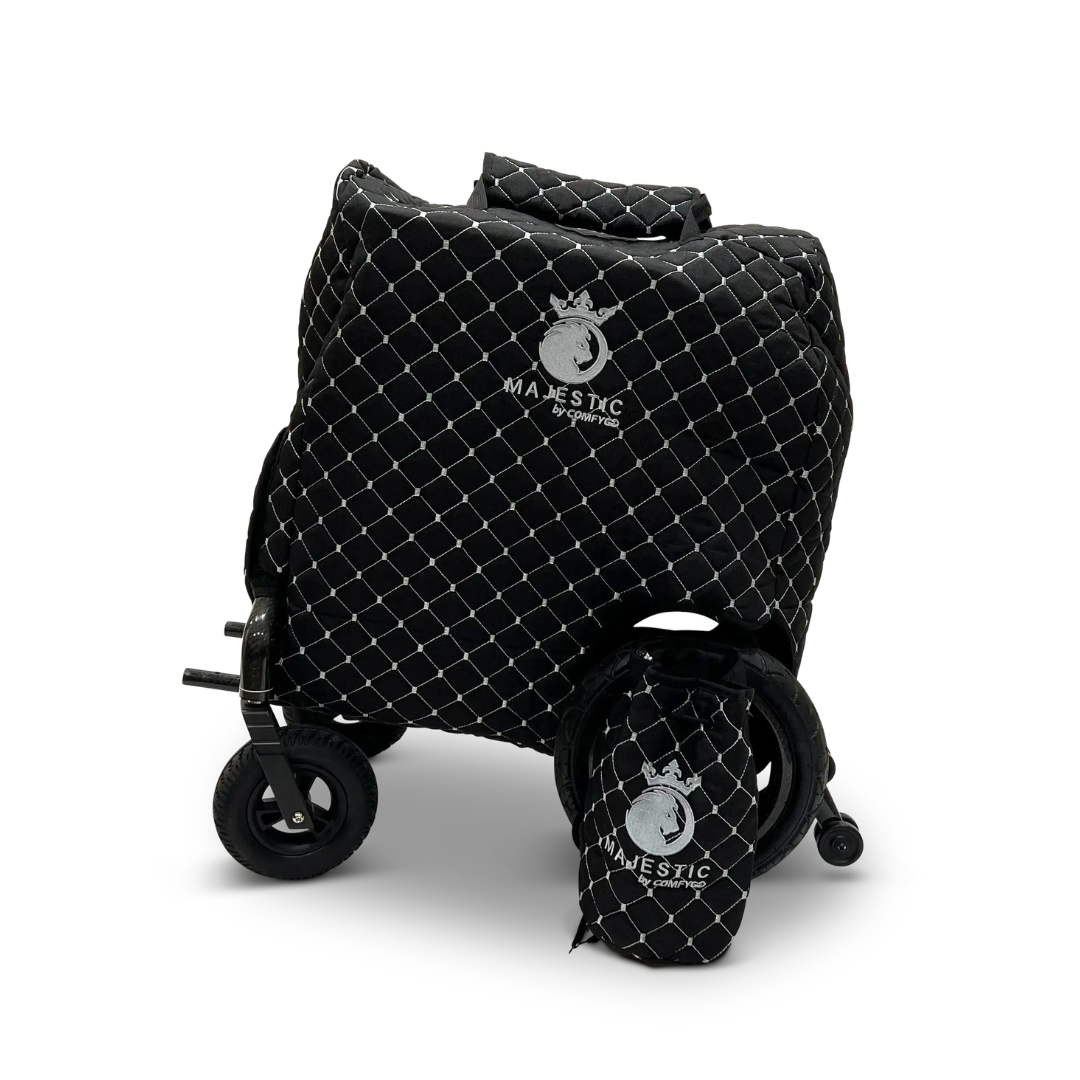 The ComfyGo Phoenix Electric Wheelchair Travel Bag & Protector Set includes a black, quilted bag with a white diamond pattern and Majestic by Geprek logo that shields the folding cart and joystick, plus a matching smaller quilted front bag.