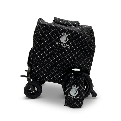 The ComfyGo Phoenix Electric Wheelchair Travel Bag & Protector Set includes a black, quilted bag with a white diamond pattern and Majestic by Geprek logo that shields the folding cart and joystick, plus a matching smaller quilted front bag.