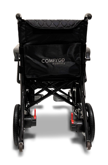 The ComfyGo Phoenix Carbon Fiber Electric Wheelchair features a sleek black design with COMFYGO mobility on the backrest. It boasts a lightweight metal frame, red release levers for compact folding, and modern elegance typical of carbon fiber innovations.