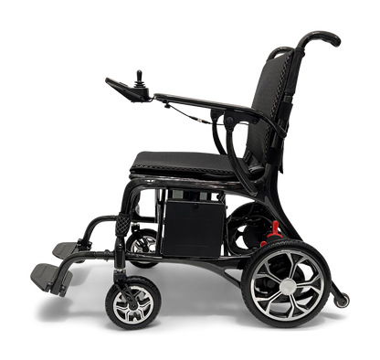 The ComfyGo Phoenix Carbon Fiber Electric Wheelchair, shown side-on against a plain background, features a joystick control on the armrest, black padded seat and backrest, sturdy carbon fiber frame, and is equipped with small front wheels and larger rear wheels for an innovative design.