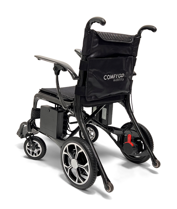 The ComfyGo Phoenix Carbon Fiber Electric Wheelchair is a lightweight, portable option with a black frame and seat. It features small front wheels, larger rear wheels, foldable armrests, and a storage compartment on the backrest. The ComfyGo Mobility brand is subtly displayed.
