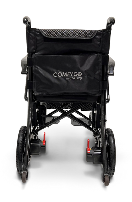 Rear view of the stylish ComfyGo Phoenix Carbon Fiber Electric Wheelchair. The foldable black chair features a mesh backrest, red lever locks on the rear wheels, and the brand name printed on the back for style and convenience on the move.