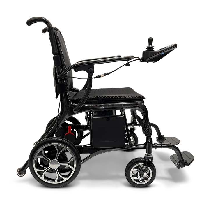 The ComfyGo Phoenix Carbon Fiber Electric Wheelchair boasts a side view showing its sleek design with large rear wheels, smaller front wheels, and armrest joystick control. Its cushioned seat and backrest ensure comfort, while carbon fiber parts enhance durability, set against a plain backdrop.