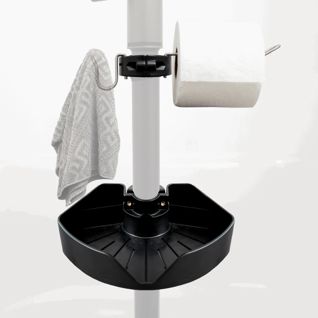 A close-up of the Stander Security Pole Bin Accessory Pack: a clamp-on organizer bin holding a gray towel, a roll of toilet paper, and a black tray, all shown against a white background.