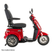 A side profile of the Pride Baja® Raptor® 2 Bariatric 3-Wheel Scooter in red, featuring a cushioned seat with armrests, rear view mirrors, and LED lighting. Text in the corner: Non-medical device. Perfect for outdoor mobility.