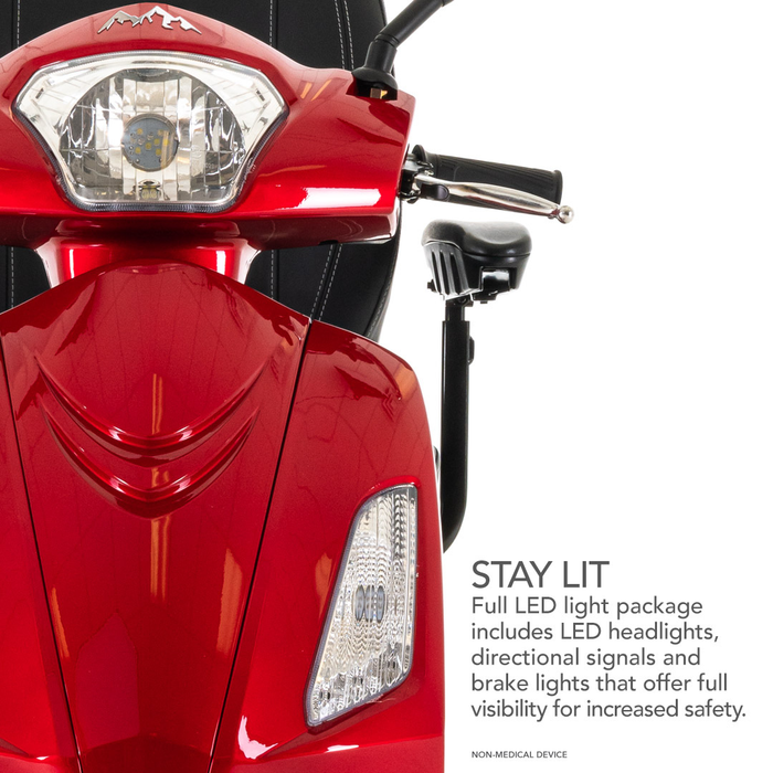 A close-up of the red Pride Baja® Raptor® 2 Bariatric 3-Wheel Scooter with full LED headlights, signals, and brake lights for better outdoor safety. Text: STAY LIT. Enhanced mobility with complete LED light package.