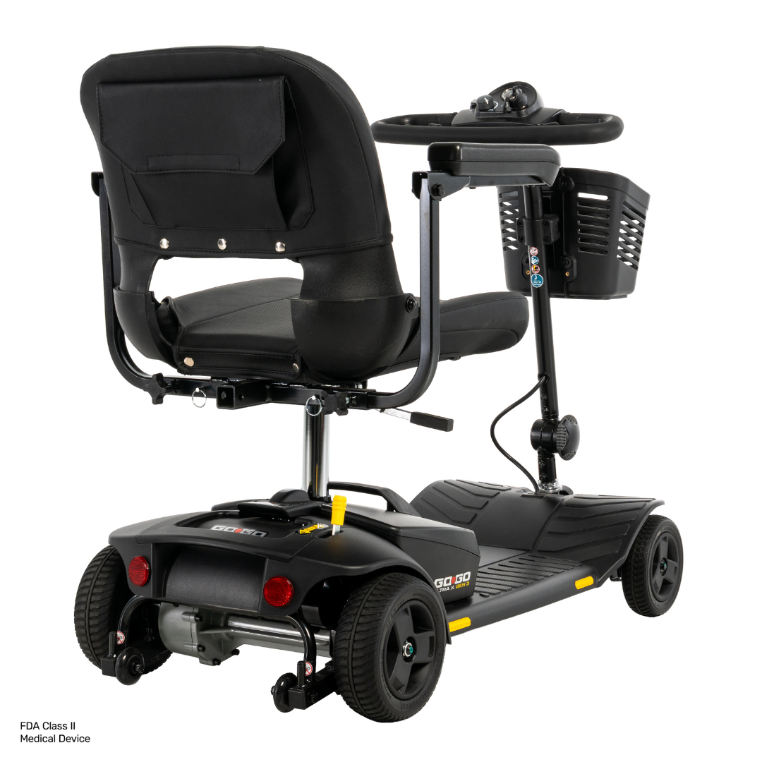 A black Pride Go Go® Ultra X Gen 3 Portable Mobility Scooter is shown from the rear left angle, displaying the seat, rear wheels, handlebar, storage basket, and control panel. This scooter is lightweight and designed as a portable mobility solution for both indoor and outdoor use.