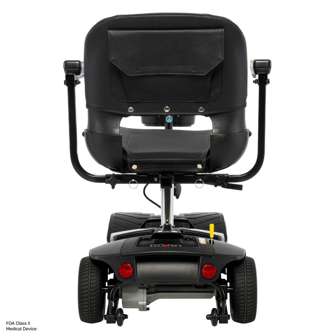 Rear view of a black Pride Go Go® Ultra X Gen 3 Portable Mobility Scooter, featuring the seat, armrests, wheels, and back storage pocket. This scooter is designed for personal transportation and enhanced accessibility.
