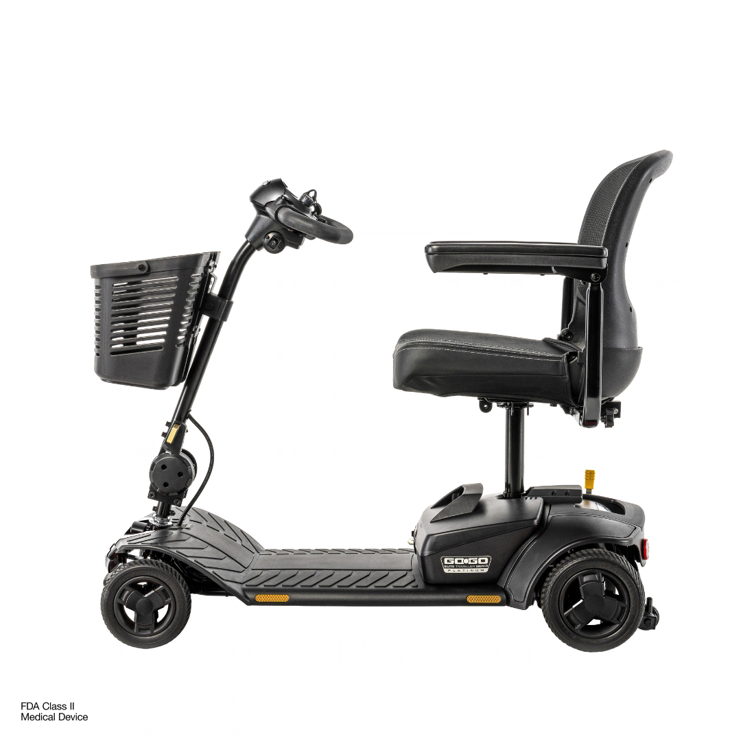 A black, four-wheeled Pride Go Go® Elite Traveller Gen 3 Platinum Portable Scooter shown from the side, featuring a swivel seat, a handlebar tiller, and a front-mounted storage basket with access to downloads and specifications.
