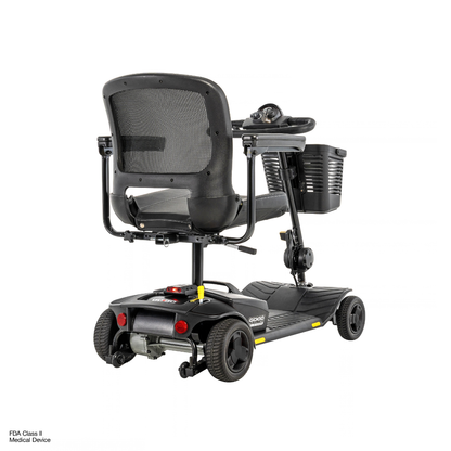 Rear view of a black Pride Go Go® Elite Traveller Gen 3 Platinum Portable Scooter, featuring a mesh backrest, a front-mounted basket, and a black floorboard; see specifications for further details.