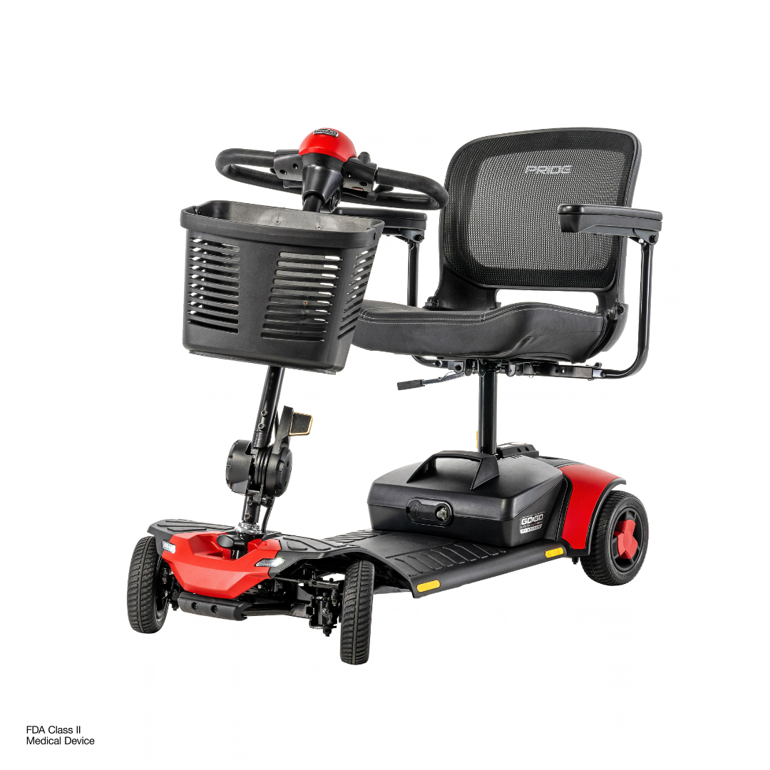 A black and red Pride Go Go® Elite Traveller Gen 3 Platinum Portable Scooter with four wheels, a mesh seat, and a front storage basket.