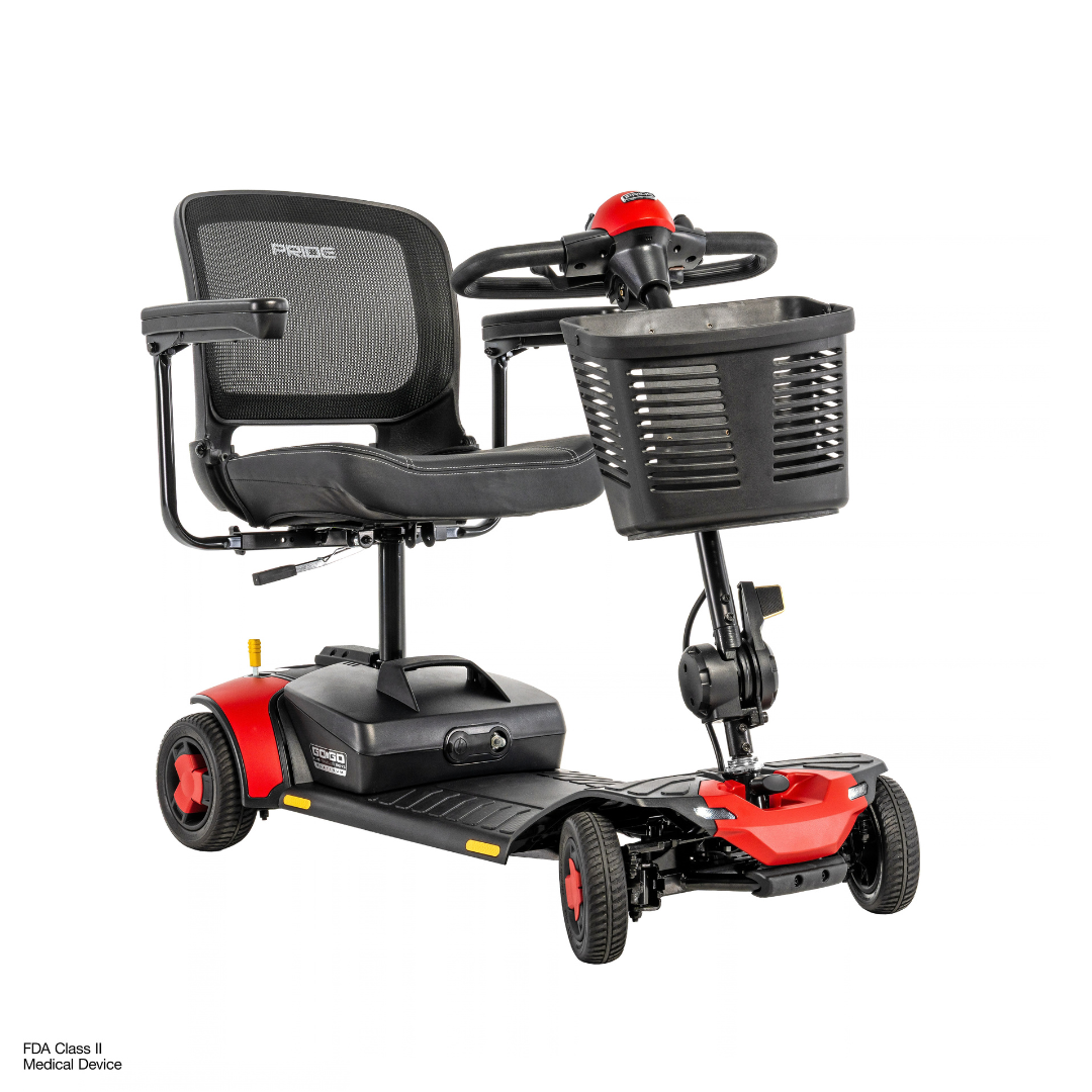 Pride Go Go® Elite Traveller Gen 3 Platinum Portable Scooter in red and black, featuring four wheels, a mesh backrest, armrests, and a front storage basket; see specifications and downloads for more details.