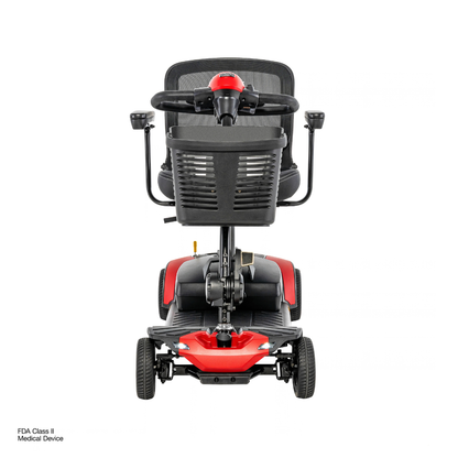 Front view of a Pride Go Go® Elite Traveller Gen 3 Platinum Portable Scooter with a red base, black mesh seat, and a storage basket on the tiller, alongside links for specifications and downloads.