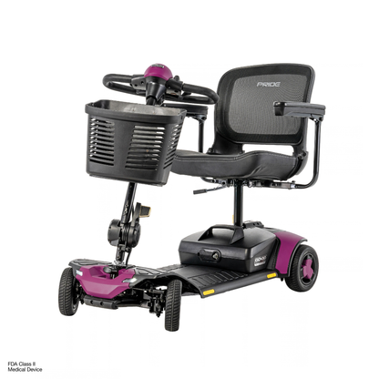 Pride Go Go® Elite Traveller Gen 3 Platinum Portable Scooter, a four-wheeled purple and black mobility scooter with a front basket and a mesh back seat.