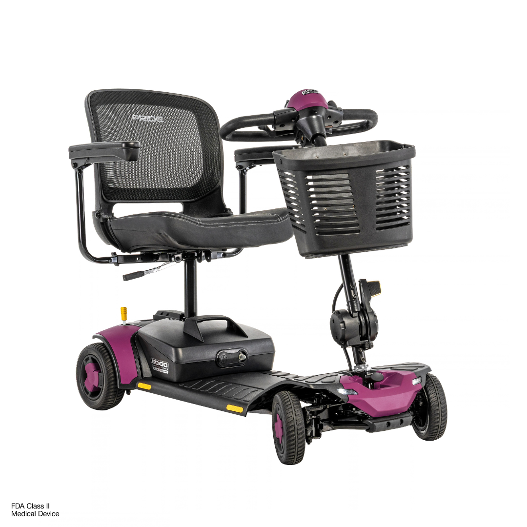 Pride Go Go® Elite Traveller Gen 3 Platinum Portable Scooter, a four-wheeled mobility scooter with a purple frame, black mesh seat, and front storage basket; see downloads for full specifications.