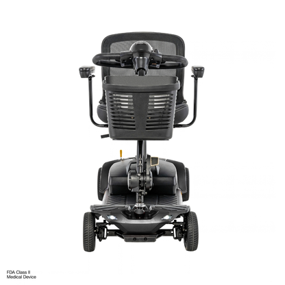A front view of the Pride Go Go® Elite Traveller Gen 3 Platinum Portable Scooter, a four-wheeled mobility scooter featuring a black mesh seat, handlebars, and a front-mounted storage basket.
