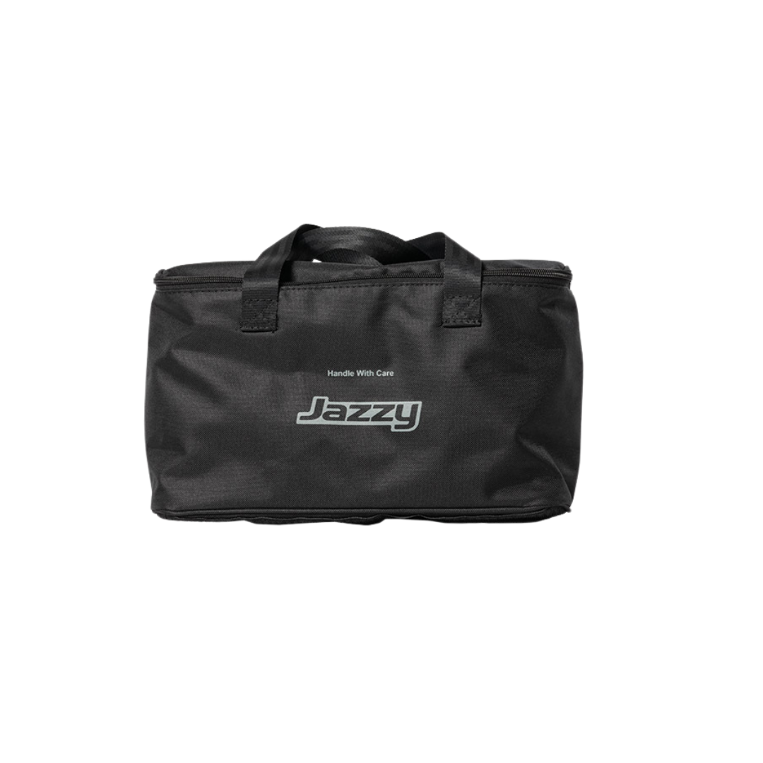 A black rectangular carrying bag with short handles, labeled "Jazzy" and "Handle With Care" in white, perfect for storing Accessories for the Jazzy® Carbon 27X Powerchair like lightweight powerchair extras or travel battery essentials.
