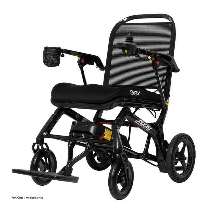The Pride Mobility Jazzy® Ultra Light Portable Electric Wheelchair features a black foldable design with a sleek carbon fiber frame, mesh backrest, cushioned seat and armrests. A right joystick control enhances its ease of use, while solid wheels provide stability and convenience.