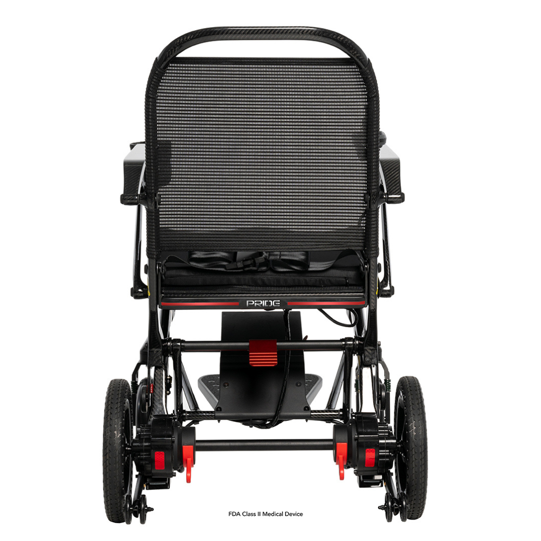 Rear view of the Jazzy® Ultra Light Portable Electric Wheelchair in black and red, showcasing its carbon fiber frame. The image highlights the backrest, handle, and large wheels, emphasizing its practical design with a sturdy yet lightweight construction.