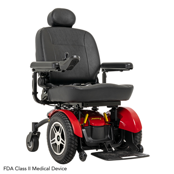The Pride Jazzy® Elite 14 Powerchair offers a high back and black seat with a red base. It includes armrests, a right-side joystick, and 14” knobby tires for traction. As an FDA Class II Medical Device, it provides stable front-wheel drive for reliable mobility.