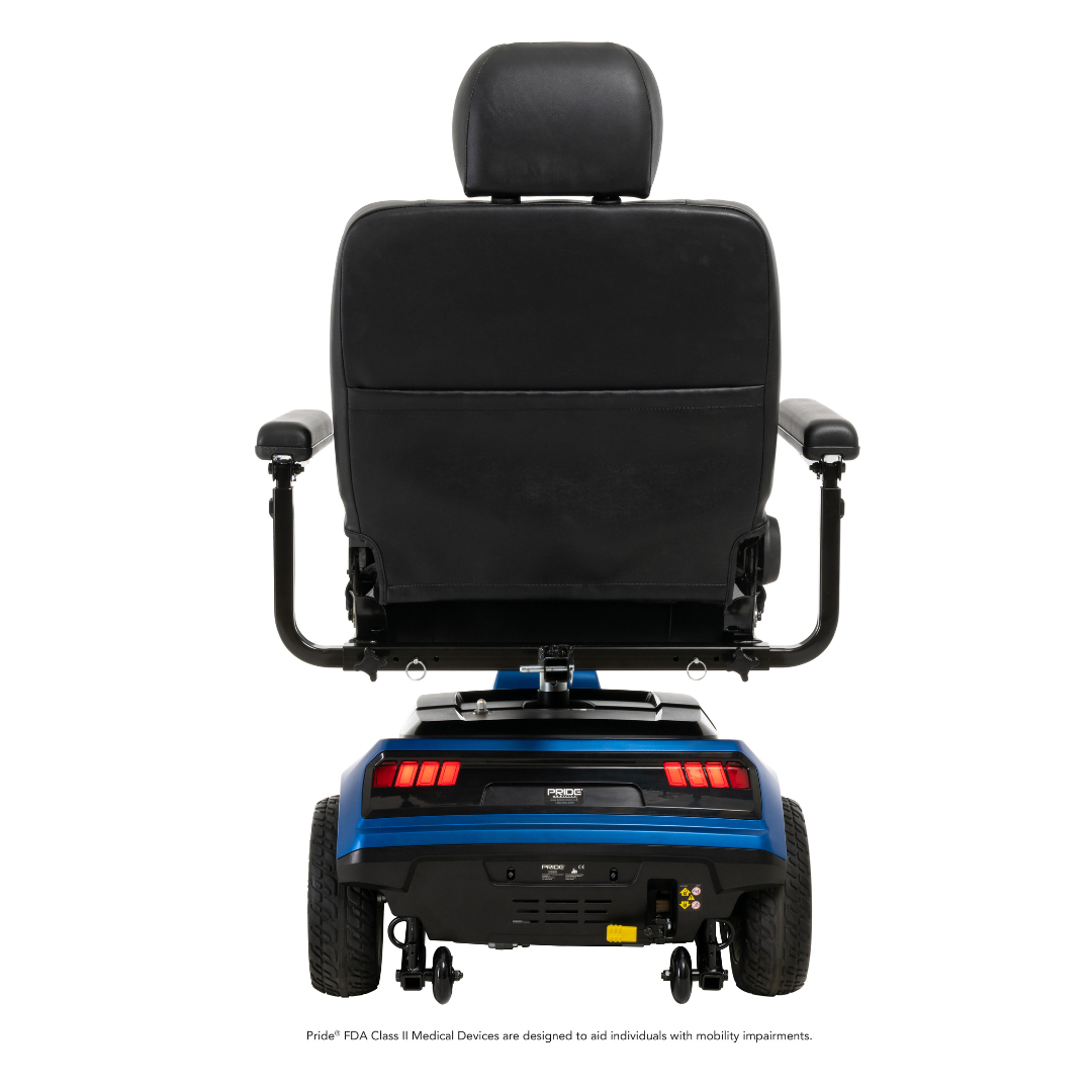 A rear view of a blue Pride Mobility Maxima 3-Wheel Bariatric Scooter with a black cushioned seat, armrests, and large wheels, designed for enhanced mobility support and featuring a 500 lb weight capacity.