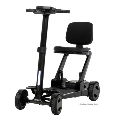 The Pride Mobility GoGo Carbon Ultralite Scooter, weighing just 35 lbs, is a black portable scooter featuring a modern design with a padded seat, steering handlebar, and four wheels for stability. Its lightweight and compact carbon fiber frame ensures easy transport.
