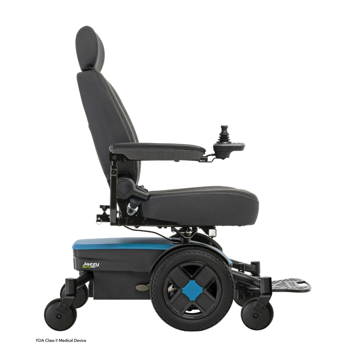 A side view of the Pride Mobility Jazzy® EVO 613 Powerchair with ATX Suspension, featuring a cushioned seat, backrest, armrests, footrest, joystick control, and large rear wheels with Mid-Wheel 6® Technology on a white background.