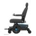 A side view of the Pride Mobility Jazzy® EVO 613 Powerchair with ATX Suspension, featuring a black seat, armrests, joystick control, blue base accents, Mid-Wheel 6® Technology for maneuverability, and large rear wheels with smaller front wheels.