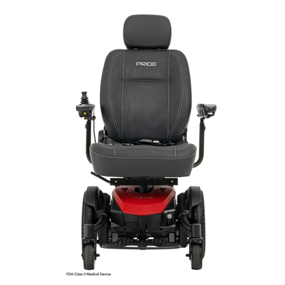 The Pride Mobility Jazzy® EVO 613 Powerchair with ATX Suspension has a black and red design, padded seat, armrests, headrest, right-side controller, Mid-Wheel 6® Technology, and PRIDE embroidered on the seat back. Viewed from the front.